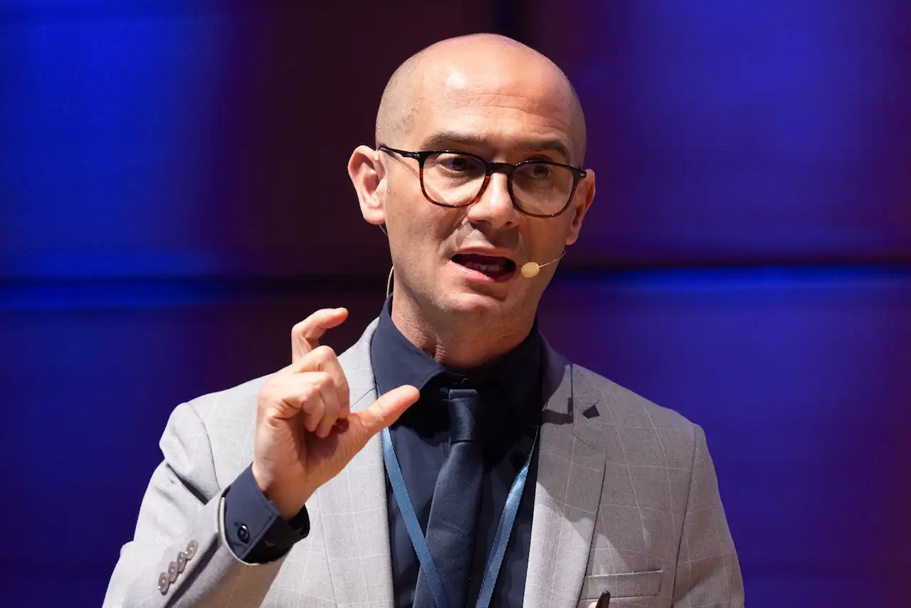 A speaker on stage at ITL 2026