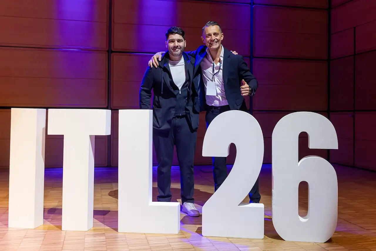 Two guests on stage behind the ITL 26 letters